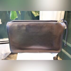 Vintage brown leather clutch is a Coach NYC Bonnie Cashin Basic Bag.